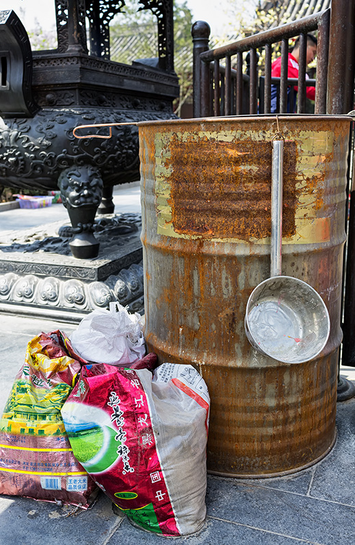 Oil drum and ladle at the Guanji Temple, Fuchengmen Inner Street, Xicheng, Beijing, China.