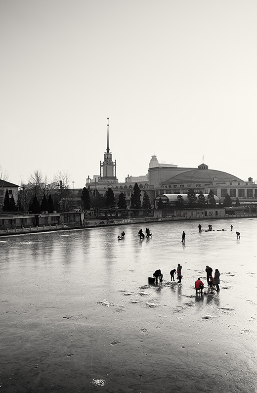 People on the frozen Nanchang River Marina, Xicheng, Beijing, China.