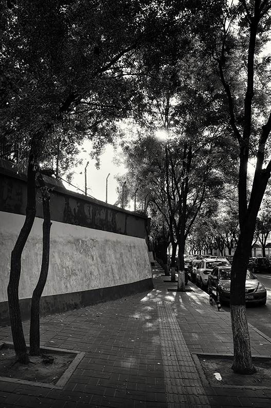Sidewalk narrows because of boundary wall on Beiwa East Road, Haidian, Beijing, China.
